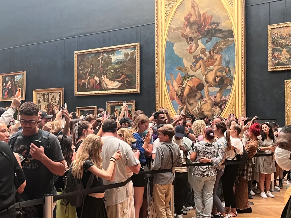 Crowds waiting to view the Mona Lisa. 
