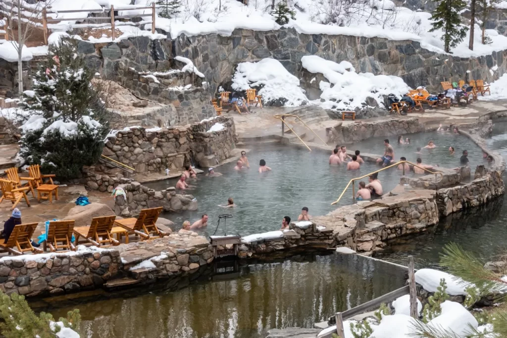 People swimming in the Strawberry Park Hot Springs in Steamboat Springs, Colorado