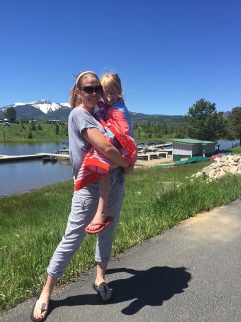 Mom and child at Steamboat Lake Colorado with Hahns Peak in the background