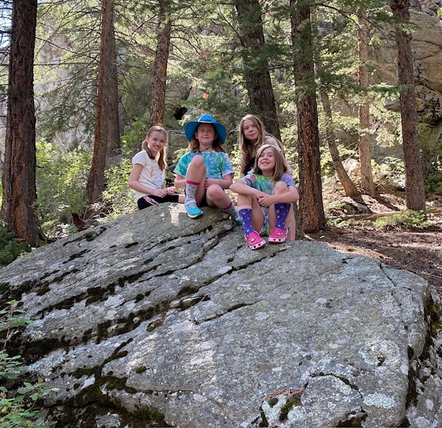 Girls on a rock while camping near Black Hawk, Colorado 