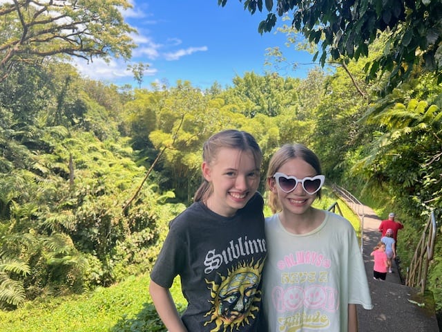 Kids posing on the hike to Akaka Falls on the Big Island of Hawaii
