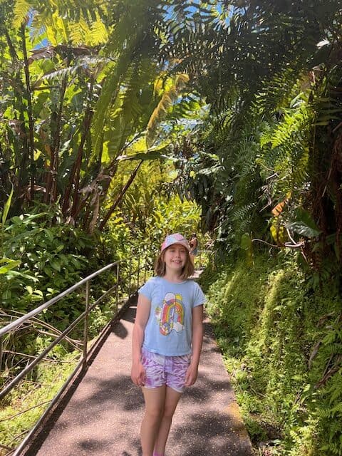 Girl wearing a hat while hiking in Hawaii. 