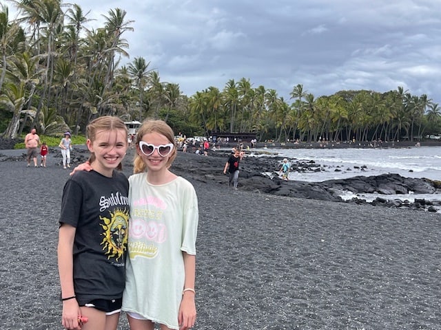 Girls at the black sand beach on the Big Island of Hawaii