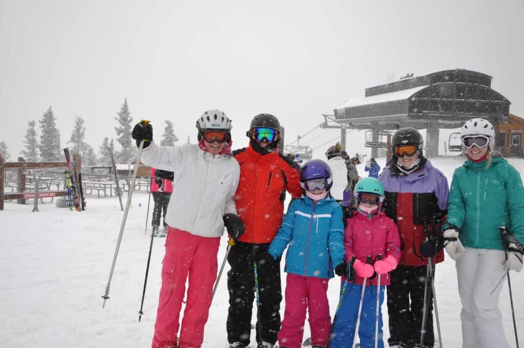 Family skiing Colorado wearing warm ski gear