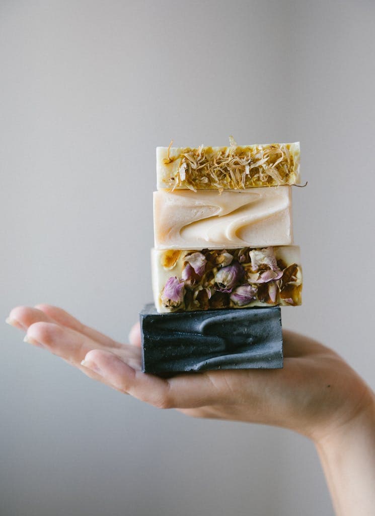 Person Holding Various Organic Bar Soaps