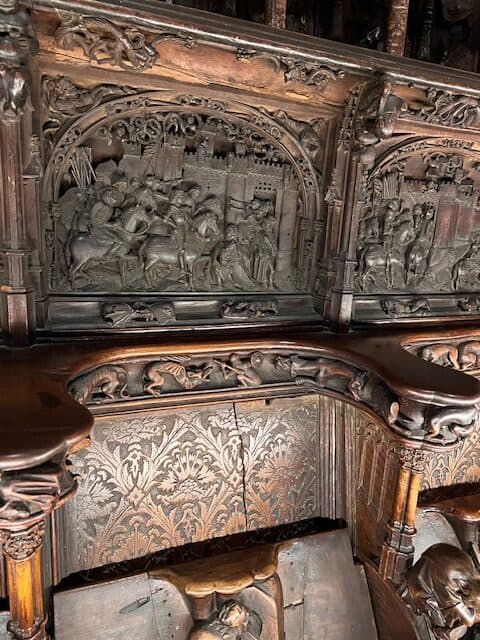 Wooden carved stalls in the Choir located in the Cathedral of Toledo in Spain