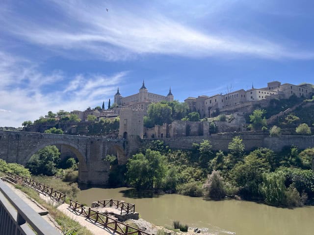 View of the Tagus River and hilltop buildings in Toledo, Spain