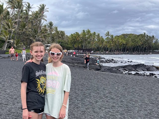 Girls at the Black sands beach in Kona, Hawaii