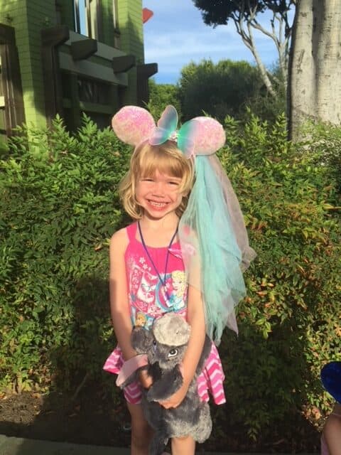 Little girl posing with Mini Mouse princess ears