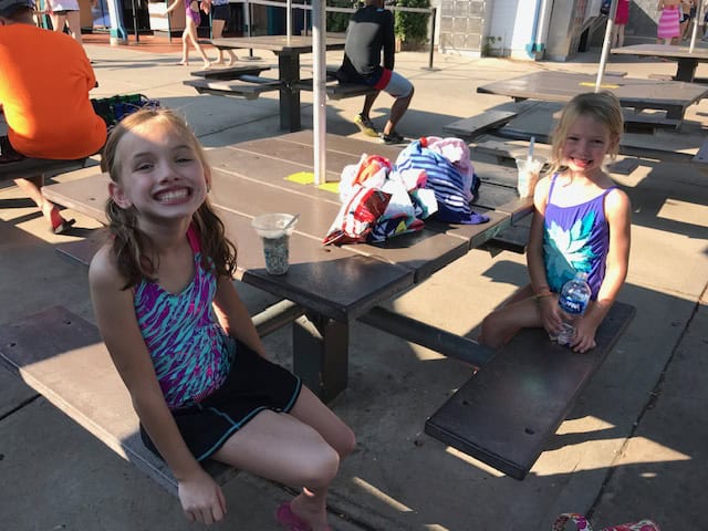 Kids at a picnic table at Water World in Denver, Colorado