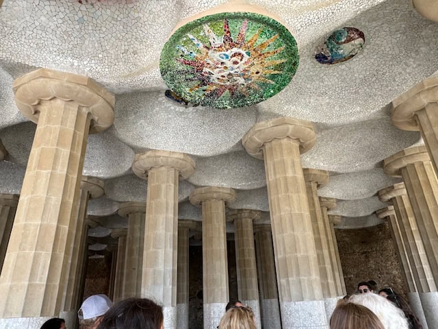 Columns with mosaic tiles in Park Guell, Barcelona, Spain