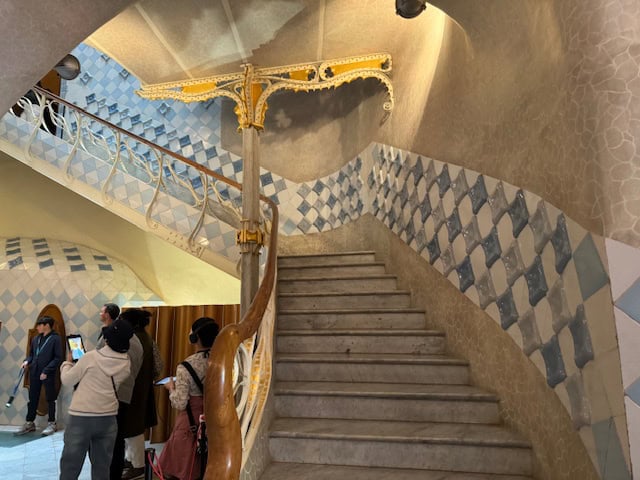 Staircase with blue tiled walls at Casa Batllo in Barcelona, Spain