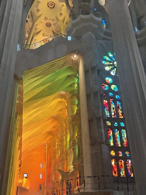 Light reflecting from the stained glass windows at the Sagrada Familia in Barcelona, Spain