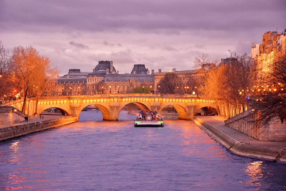 Boat on the river Seine in the evening