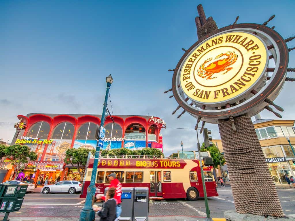 View of a Big Bus and Riplies Believe it or Not and the San Francisco Fishermans Wharf sign. 